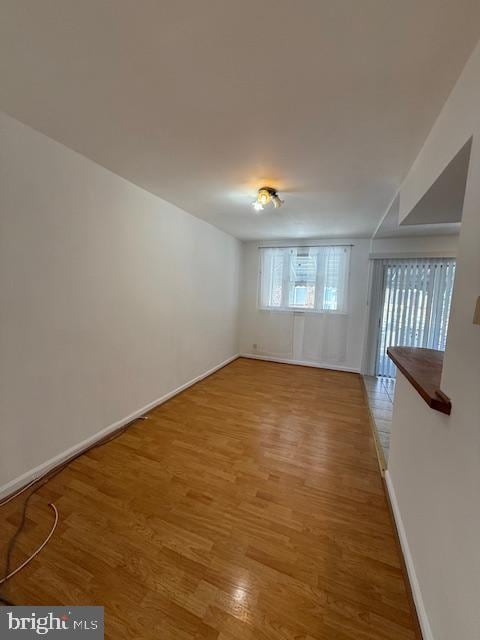 empty room featuring wood-type flooring