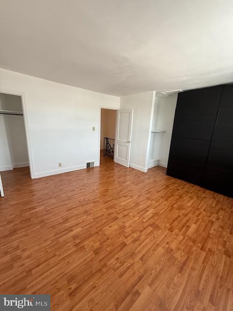 unfurnished bedroom featuring light wood-type flooring