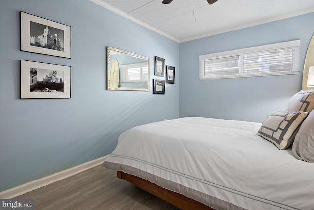 bedroom featuring crown molding, ceiling fan, and dark hardwood / wood-style floors