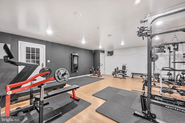 workout room with wood-type flooring