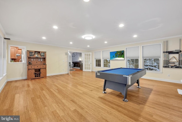 recreation room with light hardwood / wood-style flooring, french doors, billiards, a healthy amount of sunlight, and ornamental molding