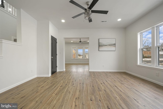 unfurnished room featuring ceiling fan and light hardwood / wood-style flooring