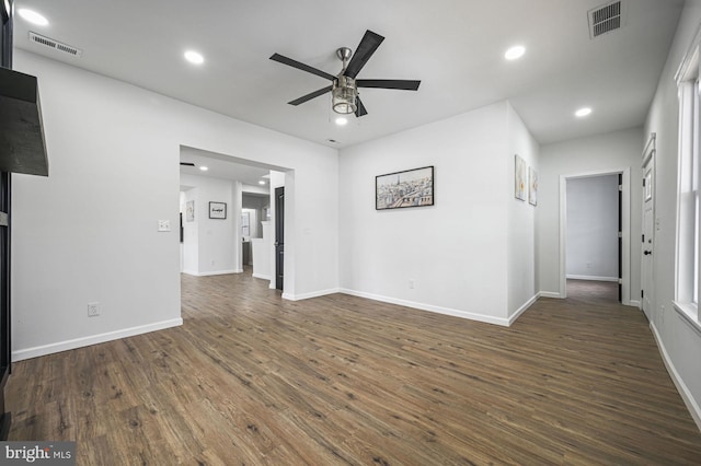 unfurnished room featuring dark hardwood / wood-style floors and ceiling fan