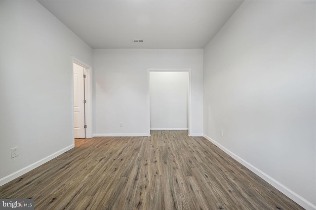 unfurnished room featuring hardwood / wood-style flooring