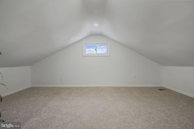 bonus room featuring carpet floors and lofted ceiling