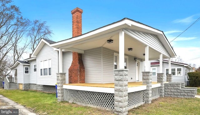 view of home's exterior with covered porch