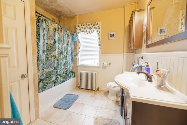 full bathroom with radiator, vanity, shower / bath combination with curtain, tile patterned floors, and toilet