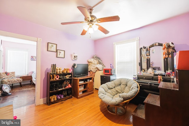 interior space featuring light hardwood / wood-style floors and ceiling fan