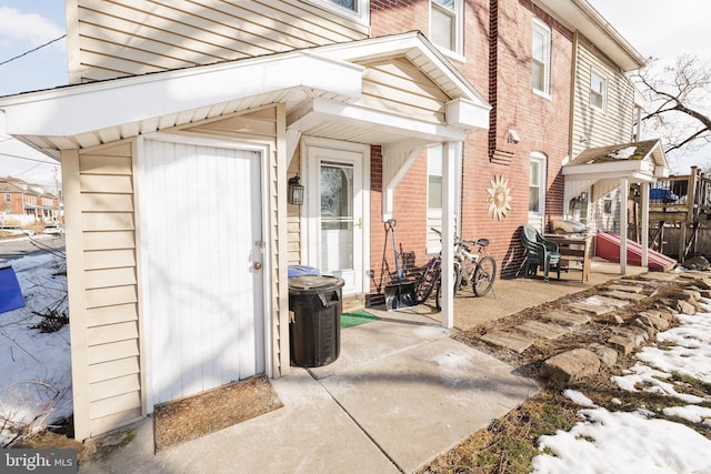 property entrance with a patio