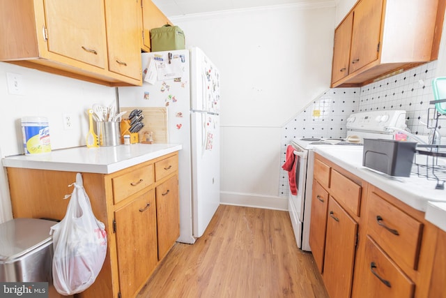 kitchen with crown molding, white appliances, decorative backsplash, and light hardwood / wood-style flooring