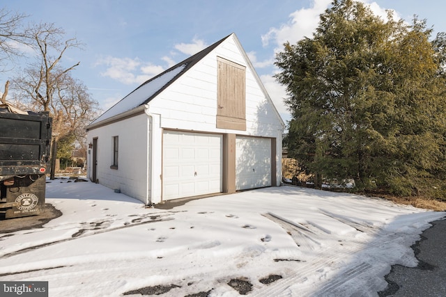 view of snow covered garage