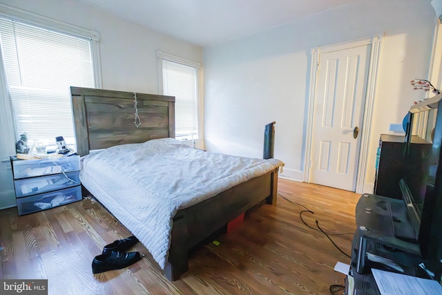 bedroom featuring dark wood-type flooring