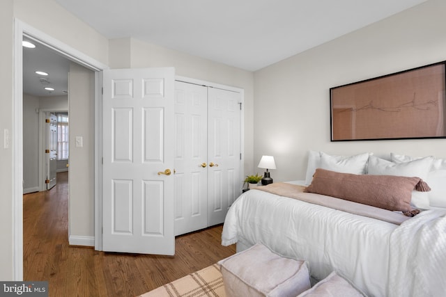 bedroom featuring a closet and hardwood / wood-style floors