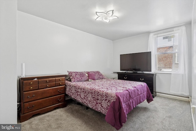 bedroom featuring light carpet and a baseboard radiator