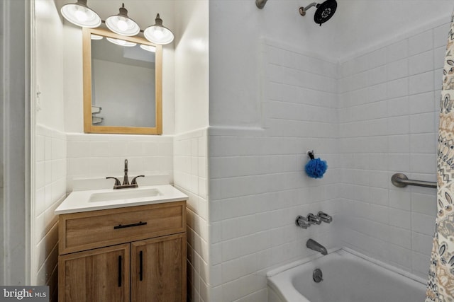 bathroom featuring vanity and shower / bath combination with curtain