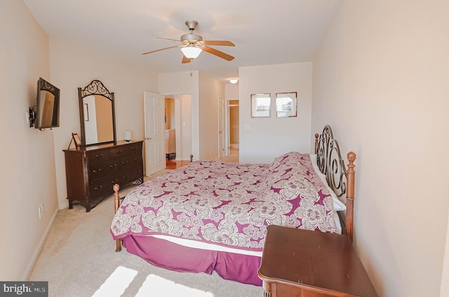 bedroom with ceiling fan and light carpet