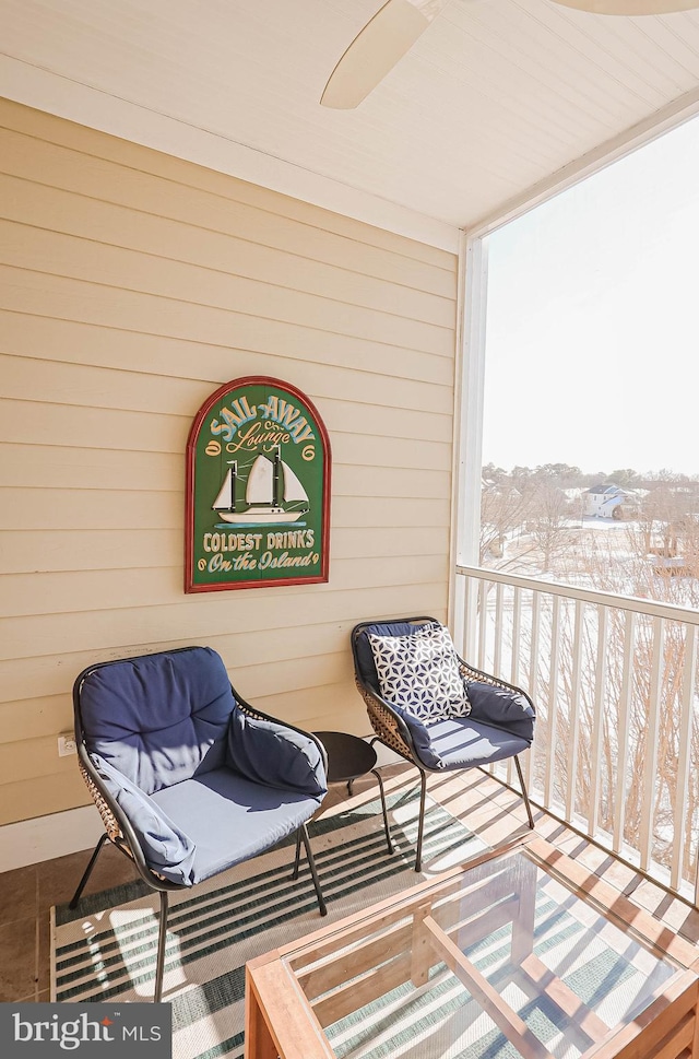 view of snow covered back of property