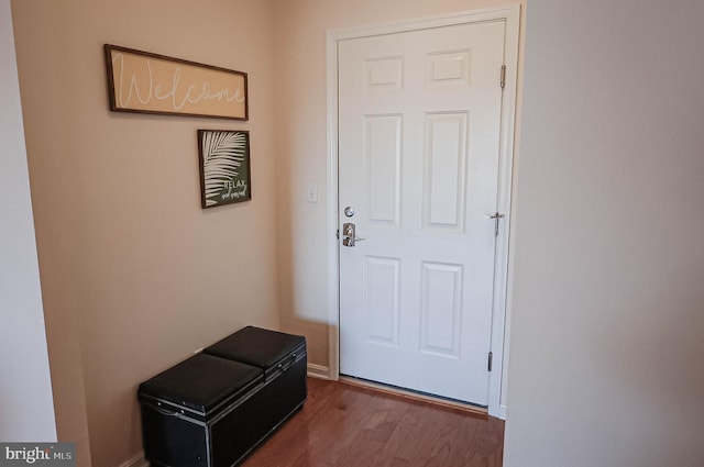 doorway to outside with wood-type flooring