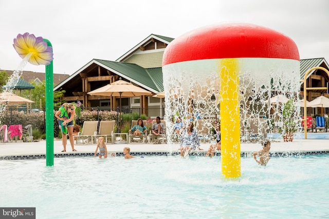 exterior space with pool water feature