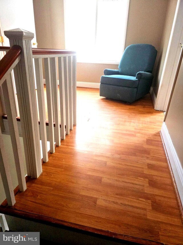 stairway featuring hardwood / wood-style floors