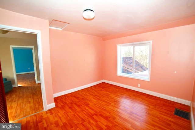 empty room featuring wood-type flooring