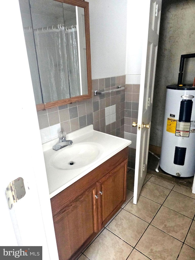 bathroom featuring vanity, tile patterned floors, and electric water heater