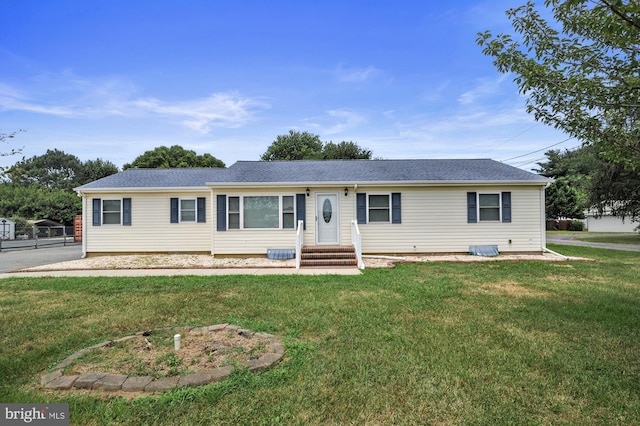 single story home featuring a front yard