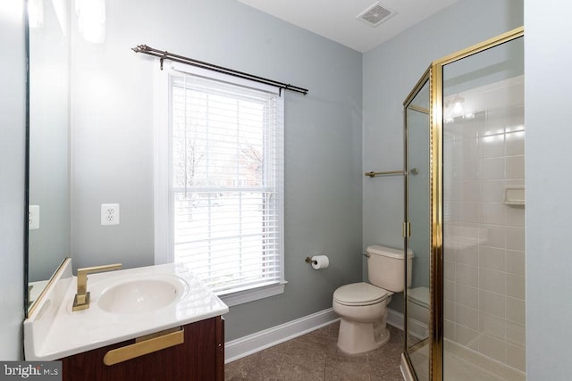 bathroom with tile patterned flooring, toilet, walk in shower, and vanity