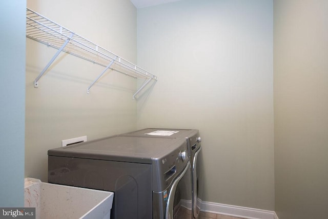 laundry room with washing machine and dryer