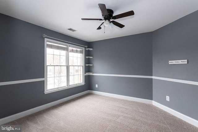 empty room with carpet flooring and ceiling fan