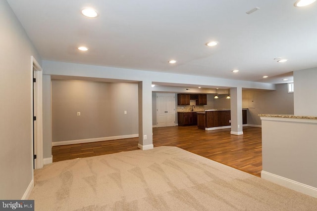 interior space with sink and dark hardwood / wood-style flooring