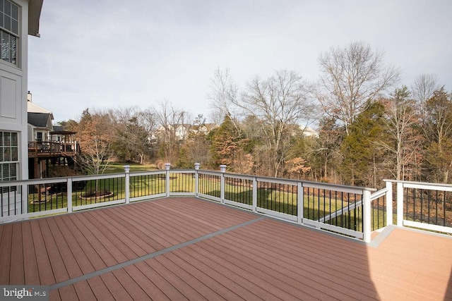 wooden deck with a yard