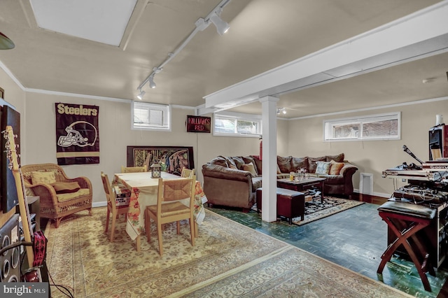 interior space featuring crown molding, a wealth of natural light, and track lighting