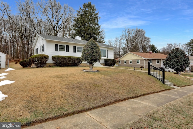 single story home with a front lawn