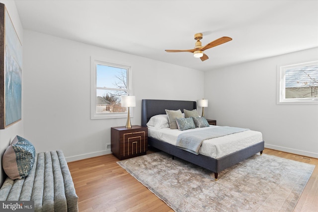 bedroom featuring ceiling fan and light hardwood / wood-style floors