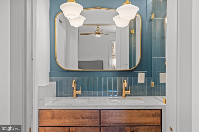 bathroom with backsplash, ceiling fan, and vanity