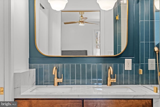 bathroom with vanity, ceiling fan, and decorative backsplash