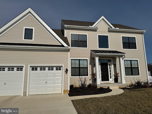 view of front of home featuring a garage and a front yard