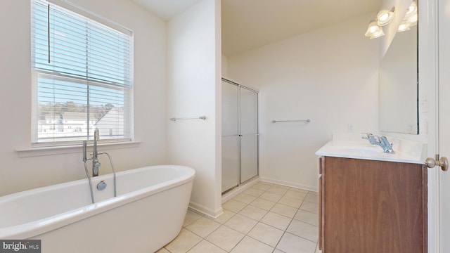 bathroom featuring vanity, a wealth of natural light, tile patterned floors, and separate shower and tub