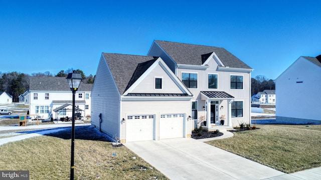 view of front facade with a garage and a front yard