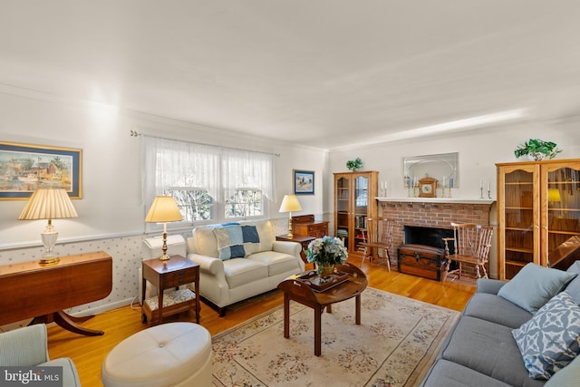 living room with a fireplace and light hardwood / wood-style floors