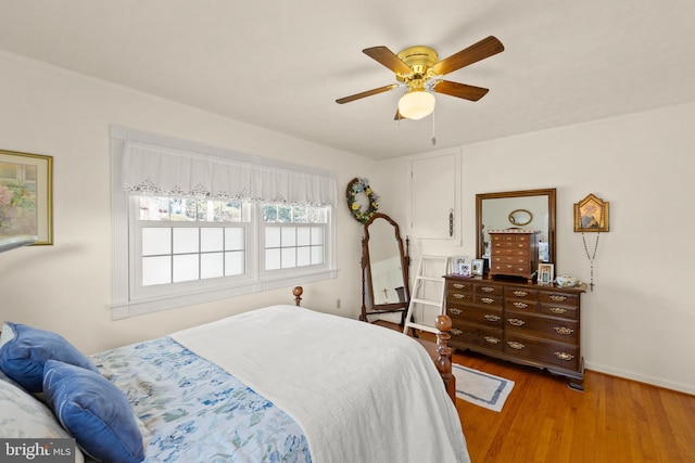 bedroom with hardwood / wood-style flooring and ceiling fan