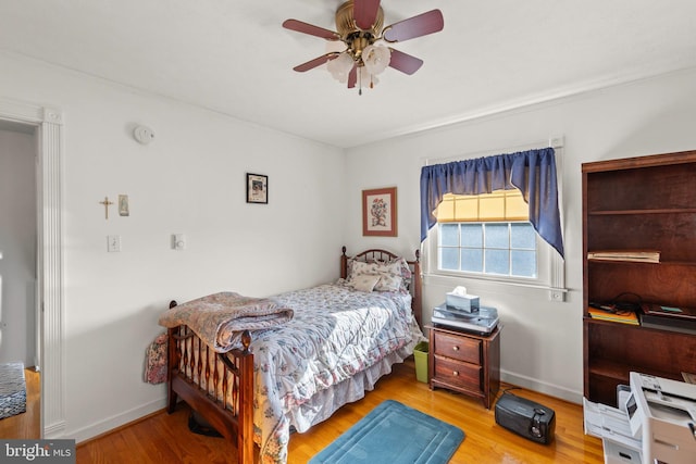 bedroom featuring ceiling fan and light wood-type flooring