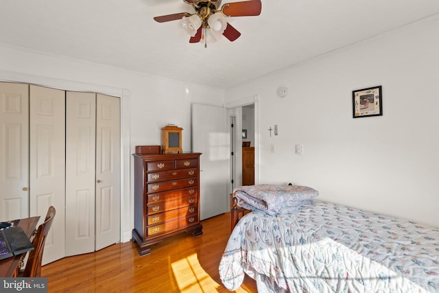 bedroom featuring a closet, ceiling fan, and light hardwood / wood-style flooring