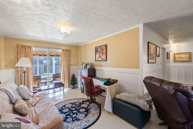 living room with crown molding and a textured ceiling