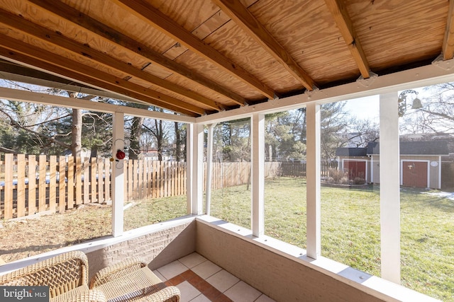 unfurnished sunroom with vaulted ceiling and wood ceiling