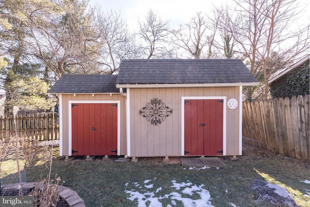 view of outdoor structure featuring a lawn