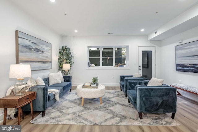 living room with light hardwood / wood-style flooring