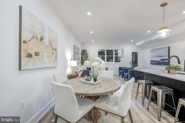 dining space featuring light hardwood / wood-style floors