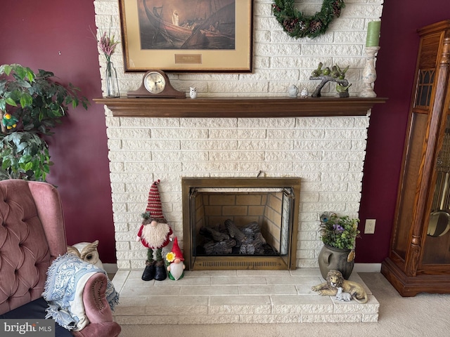 interior details featuring carpet floors and a brick fireplace